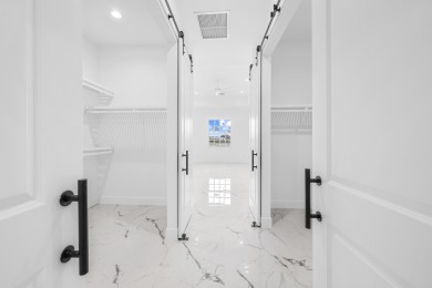 Brand-new modern estate in Palm City's prestigious Cobblestone on The Cape Club of Palm City in Florida - for sale on GolfHomes.com, golf home, golf lot