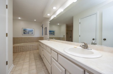 Set on a beautifully landscaped half-acre lot, this spacious on Urbandale Golf and Country Club in Iowa - for sale on GolfHomes.com, golf home, golf lot