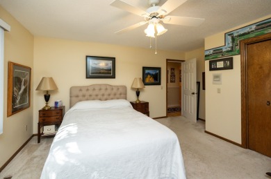 Set on a beautifully landscaped half-acre lot, this spacious on Urbandale Golf and Country Club in Iowa - for sale on GolfHomes.com, golf home, golf lot