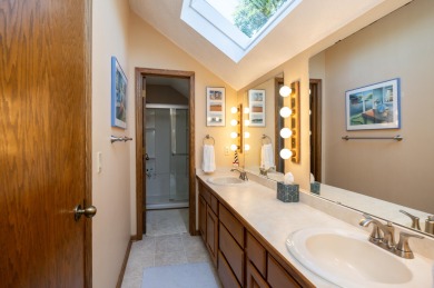 Set on a beautifully landscaped half-acre lot, this spacious on Urbandale Golf and Country Club in Iowa - for sale on GolfHomes.com, golf home, golf lot