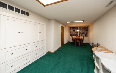 Set on a beautifully landscaped half-acre lot, this spacious on Urbandale Golf and Country Club in Iowa - for sale on GolfHomes.com, golf home, golf lot