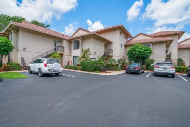 Spacious and bright 1 Bedroom, 1.5 Bath condo with serene lake on Woodfield Country Club in Florida - for sale on GolfHomes.com, golf home, golf lot