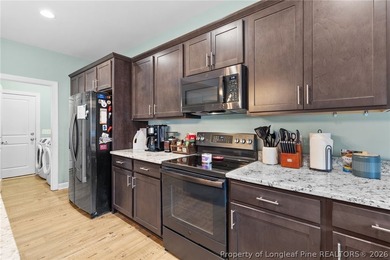 This beautiful 4-bedroom, 2.5-bath perfectly positioned on a on Woodlake Country Club in North Carolina - for sale on GolfHomes.com, golf home, golf lot