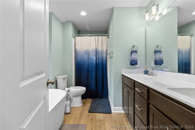 This beautiful 4-bedroom, 2.5-bath perfectly positioned on a on Woodlake Country Club in North Carolina - for sale on GolfHomes.com, golf home, golf lot