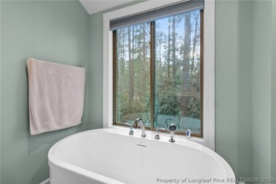 This beautiful 4-bedroom, 2.5-bath perfectly positioned on a on Woodlake Country Club in North Carolina - for sale on GolfHomes.com, golf home, golf lot