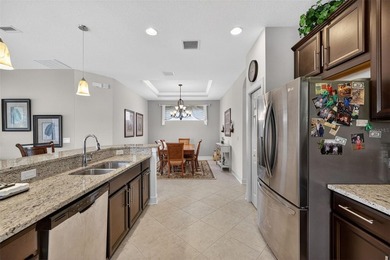 This 2-bed home in Esplanade Lakewood Ranch features tranquil on Esplanade Golf and Country at Lakewood Ranch in Florida - for sale on GolfHomes.com, golf home, golf lot