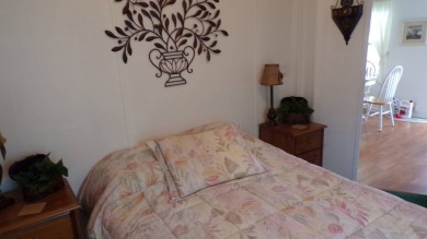 Welcome to this nice and quaint 2-bedroom home, complete with a on Schalamar Creek Golf and Country Club in Florida - for sale on GolfHomes.com, golf home, golf lot
