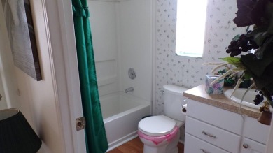 Welcome to this nice and quaint 2-bedroom home, complete with a on Schalamar Creek Golf and Country Club in Florida - for sale on GolfHomes.com, golf home, golf lot