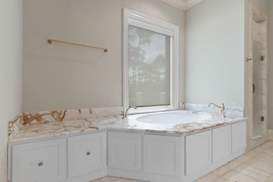 Welcome to 434 Captains Circle-an extraordinary on Regatta Bay Golf and Country Club in Florida - for sale on GolfHomes.com, golf home, golf lot