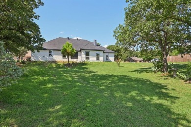 Fully updated home located on an almost 1 acre lot on the Brazos on Pecan Plantation Country Club in Texas - for sale on GolfHomes.com, golf home, golf lot
