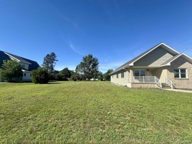 This home offers a rare opportunity to put your own finishing on Escanaba Country Club in Michigan - for sale on GolfHomes.com, golf home, golf lot