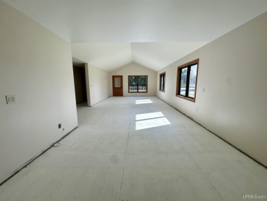 This home offers a rare opportunity to put your own finishing on Escanaba Country Club in Michigan - for sale on GolfHomes.com, golf home, golf lot