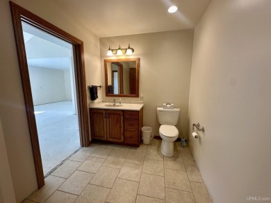 This home offers a rare opportunity to put your own finishing on Escanaba Country Club in Michigan - for sale on GolfHomes.com, golf home, golf lot