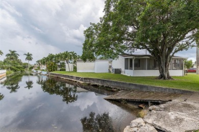 Welcome to this BEAUTIFUL, meticulously maintained manufactured on Davie Golf Club in Florida - for sale on GolfHomes.com, golf home, golf lot