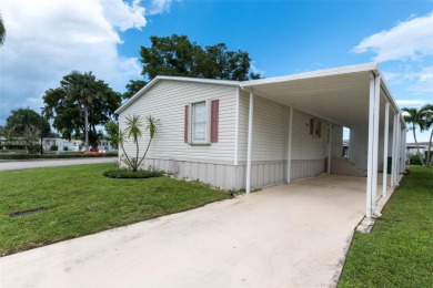 Welcome to this BEAUTIFUL, meticulously maintained manufactured on Davie Golf Club in Florida - for sale on GolfHomes.com, golf home, golf lot