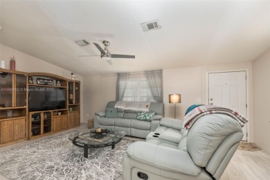 Welcome to this BEAUTIFUL, meticulously maintained manufactured on Davie Golf Club in Florida - for sale on GolfHomes.com, golf home, golf lot