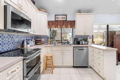 Spacious 2-bedroom, 2-bath home offering over 2,100 sq ft of on Caloosa Greens Executive Golf Course in Florida - for sale on GolfHomes.com, golf home, golf lot