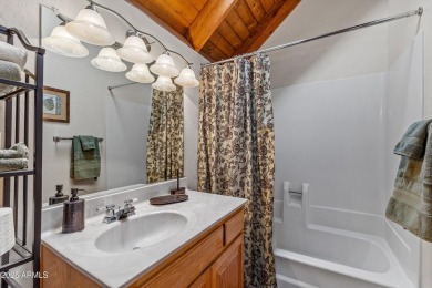 This stunning home is nestled in one of Munds Park's most on Pinewood Country Club in Arizona - for sale on GolfHomes.com, golf home, golf lot
