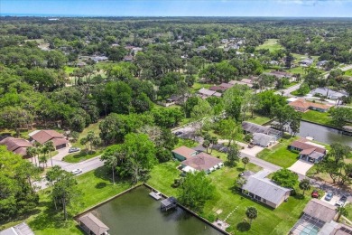 **New Waterfront Handyman Special - Your Dream Canal Home on Palm Harbor Golf Club in Florida - for sale on GolfHomes.com, golf home, golf lot