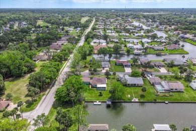**New Waterfront Handyman Special - Your Dream Canal Home on Palm Harbor Golf Club in Florida - for sale on GolfHomes.com, golf home, golf lot