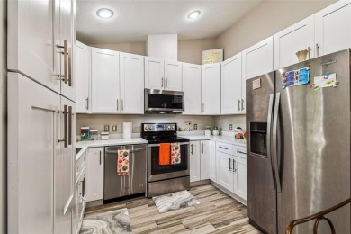 This home is located in the Forest Hills area of Tampa.  It is on Babe Zaharias Golf Course in Florida - for sale on GolfHomes.com, golf home, golf lot