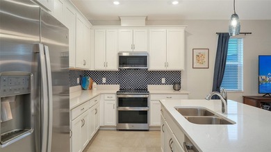 Prepare to be the envy of Lakewood Ranch! This stunning End-Unit on Tatum Ridge Golf Links in Florida - for sale on GolfHomes.com, golf home, golf lot