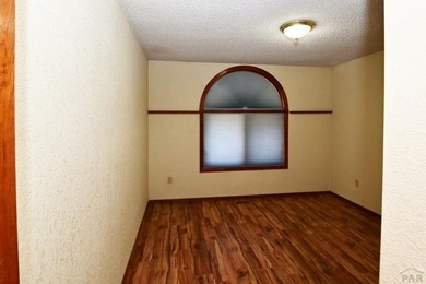 Spacious & Sun-Filled Townhome in Prime Location! Discover the on Desert Hawk At Pueblo West in Colorado - for sale on GolfHomes.com, golf home, golf lot