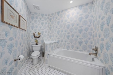 This stunning penthouse offers sweeping views down the 9th on The Sanctuary Golf Club in Florida - for sale on GolfHomes.com, golf home, golf lot