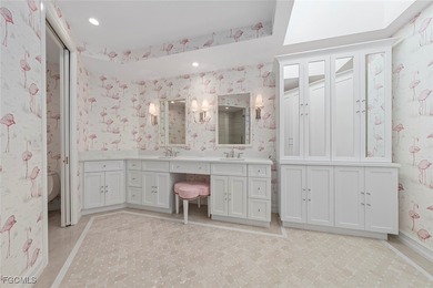 This stunning penthouse offers sweeping views down the 9th on The Sanctuary Golf Club in Florida - for sale on GolfHomes.com, golf home, golf lot