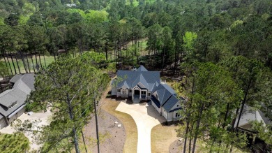 Indulge in opulent living within this custom 5-bedroom, 5.5-bath on Reynolds Lake Oconee - The Oconee in Georgia - for sale on GolfHomes.com, golf home, golf lot