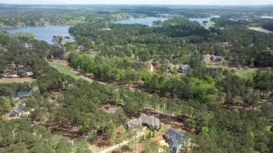 Indulge in opulent living within this custom 5-bedroom, 5.5-bath on Reynolds Lake Oconee - The Oconee in Georgia - for sale on GolfHomes.com, golf home, golf lot