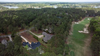Indulge in opulent living within this custom 5-bedroom, 5.5-bath on Reynolds Lake Oconee - The Oconee in Georgia - for sale on GolfHomes.com, golf home, golf lot