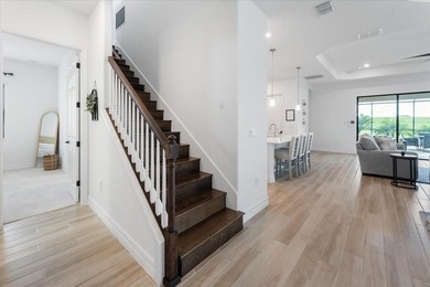 Golf, water, and sunrise views with true backyard privacy! Built on Lakewood National Golf Club in Florida - for sale on GolfHomes.com, golf home, golf lot