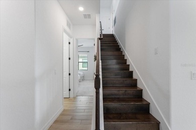 Golf, water, and sunrise views with true backyard privacy! Built on Lakewood National Golf Club in Florida - for sale on GolfHomes.com, golf home, golf lot