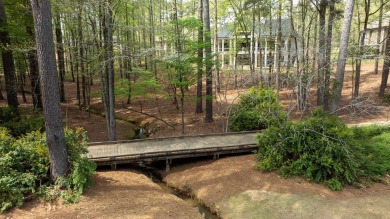 Indulge in opulent living within this custom 5-bedroom, 5.5-bath on Reynolds Lake Oconee - The Oconee in Georgia - for sale on GolfHomes.com, golf home, golf lot