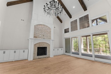 Indulge in opulent living within this custom 5-bedroom, 5.5-bath on Reynolds Lake Oconee - The Oconee in Georgia - for sale on GolfHomes.com, golf home, golf lot