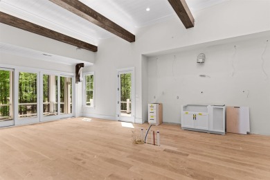 Indulge in opulent living within this custom 5-bedroom, 5.5-bath on Reynolds Lake Oconee - The Oconee in Georgia - for sale on GolfHomes.com, golf home, golf lot