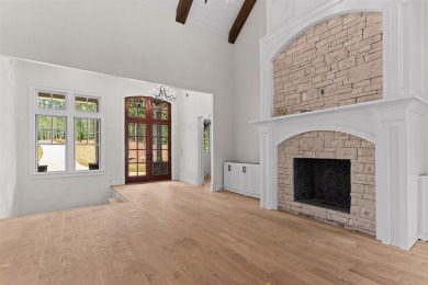 Indulge in opulent living within this custom 5-bedroom, 5.5-bath on Reynolds Lake Oconee - The Oconee in Georgia - for sale on GolfHomes.com, golf home, golf lot