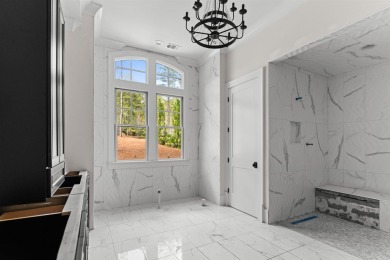 Indulge in opulent living within this custom 5-bedroom, 5.5-bath on Reynolds Lake Oconee - The Oconee in Georgia - for sale on GolfHomes.com, golf home, golf lot