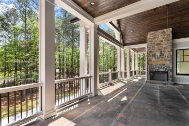 Indulge in opulent living within this custom 5-bedroom, 5.5-bath on Reynolds Lake Oconee - The Oconee in Georgia - for sale on GolfHomes.com, golf home, golf lot