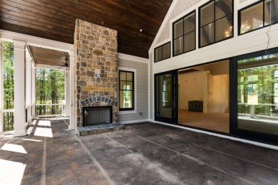 Indulge in opulent living within this custom 5-bedroom, 5.5-bath on Reynolds Lake Oconee - The Oconee in Georgia - for sale on GolfHomes.com, golf home, golf lot