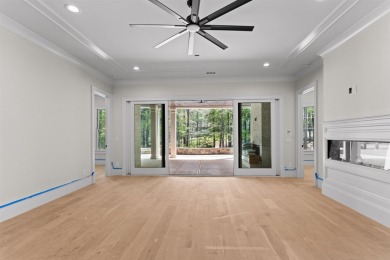 Indulge in opulent living within this custom 5-bedroom, 5.5-bath on Reynolds Lake Oconee - The Oconee in Georgia - for sale on GolfHomes.com, golf home, golf lot