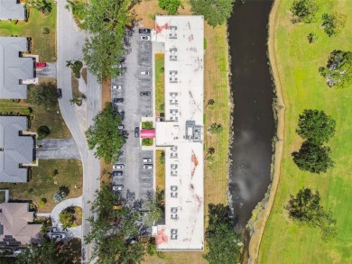 IT'S ALL ABOUT THE VIEW! Come sit and enjoy the view of the 11th on Palm Aire Country Club of Sarasota in Florida - for sale on GolfHomes.com, golf home, golf lot