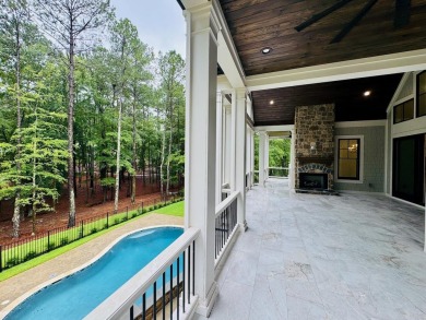 Indulge in opulent living within this extraordinary custom on Reynolds Lake Oconee - The Oconee in Georgia - for sale on GolfHomes.com, golf home, golf lot