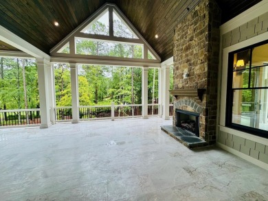 Indulge in opulent living within this extraordinary custom on Reynolds Lake Oconee - The Oconee in Georgia - for sale on GolfHomes.com, golf home, golf lot