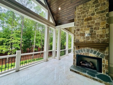 Indulge in opulent living within this extraordinary custom on Reynolds Lake Oconee - The Oconee in Georgia - for sale on GolfHomes.com, golf home, golf lot