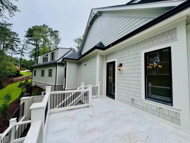 Indulge in opulent living within this extraordinary custom on Reynolds Lake Oconee - The Oconee in Georgia - for sale on GolfHomes.com, golf home, golf lot