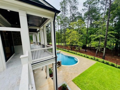 Indulge in opulent living within this extraordinary custom on Reynolds Lake Oconee - The Oconee in Georgia - for sale on GolfHomes.com, golf home, golf lot