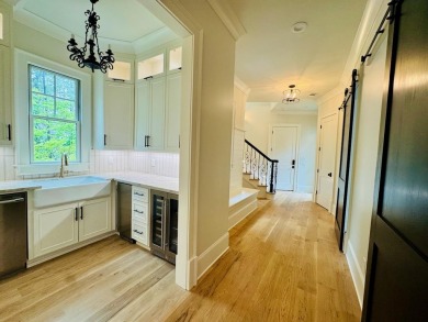 Indulge in opulent living within this extraordinary custom on Reynolds Lake Oconee - The Oconee in Georgia - for sale on GolfHomes.com, golf home, golf lot