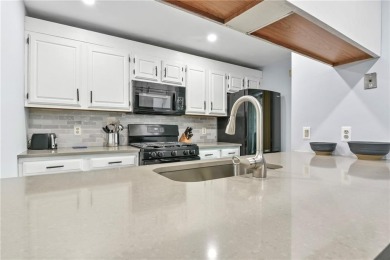Discover this welcoming condo in the desirable Fairways Complex on Woodland Greens Golf Club in Rhode Island - for sale on GolfHomes.com, golf home, golf lot